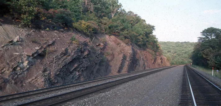 Red Catskill Formation rocks exposed along Horseshoe Curve in Pennsylvania