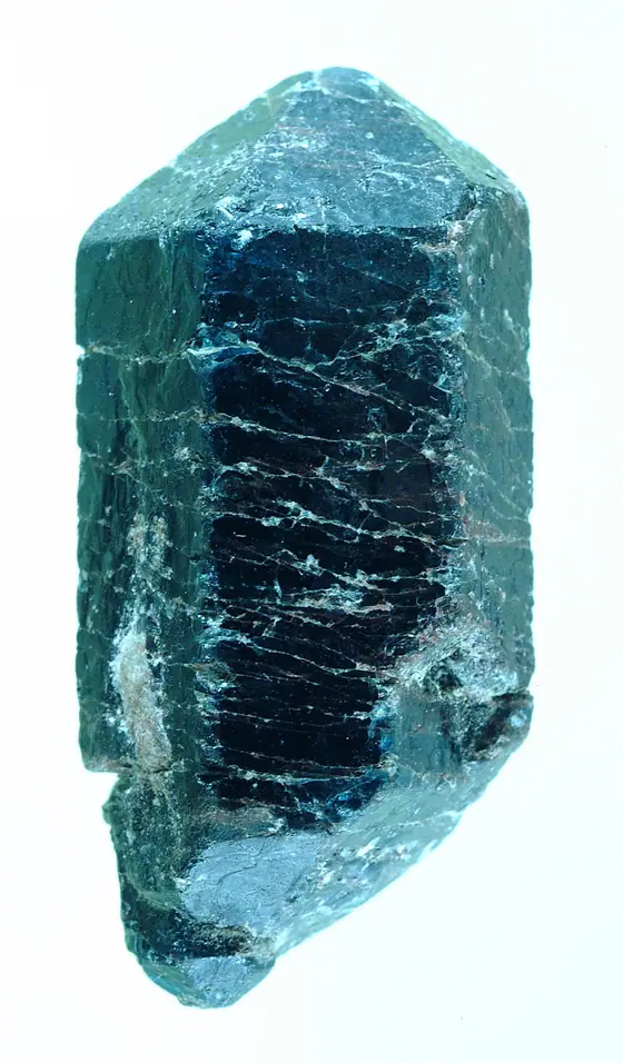 Large blue apatite crystal forming an imperfect hexagonal prism with pyramidal terminations