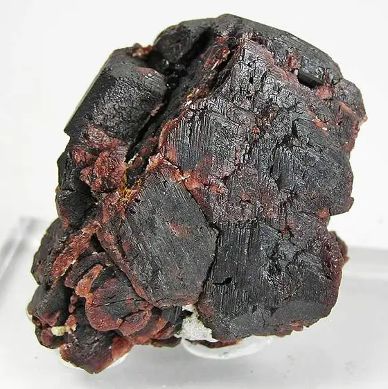 Deep red garnet crystals on a pale mineral matrix