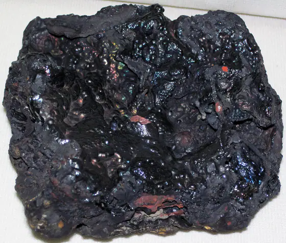 Dark metallic and reddish-brown hematite-turgite mineral specimen