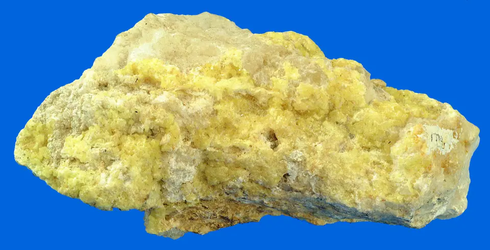 Bright yellow native sulfur coating a gray limestone specimen