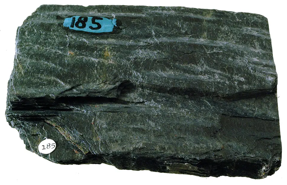 Fine-grained foliated gray phyllite with a silky sheen produced by microscopic mica