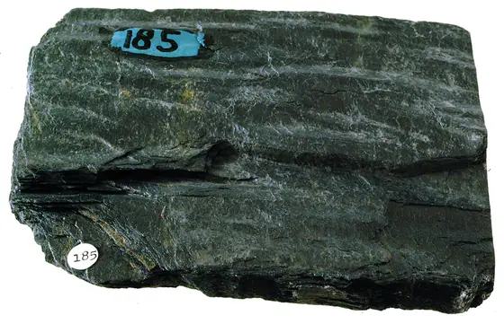 Fine-grained foliated gray phyllite with a silky sheen produced by microscopic mica